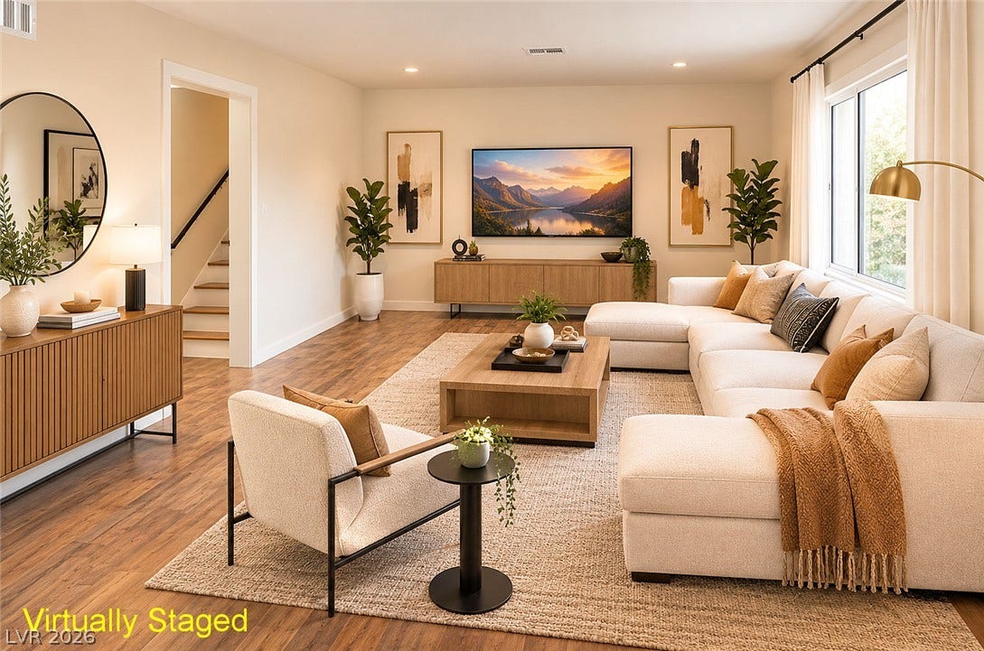 773 Cathy Lane, Henderson, NV 89015 Warm wood floors and recessed lighting anchor this inviting living space.