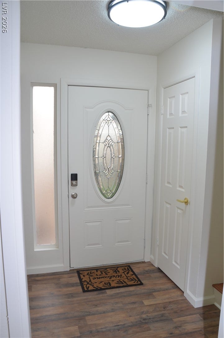 773 Cathy Lane, Henderson, NV 89015 An inviting entryway features a decorative glass insert door and durable wood-look flooring.
