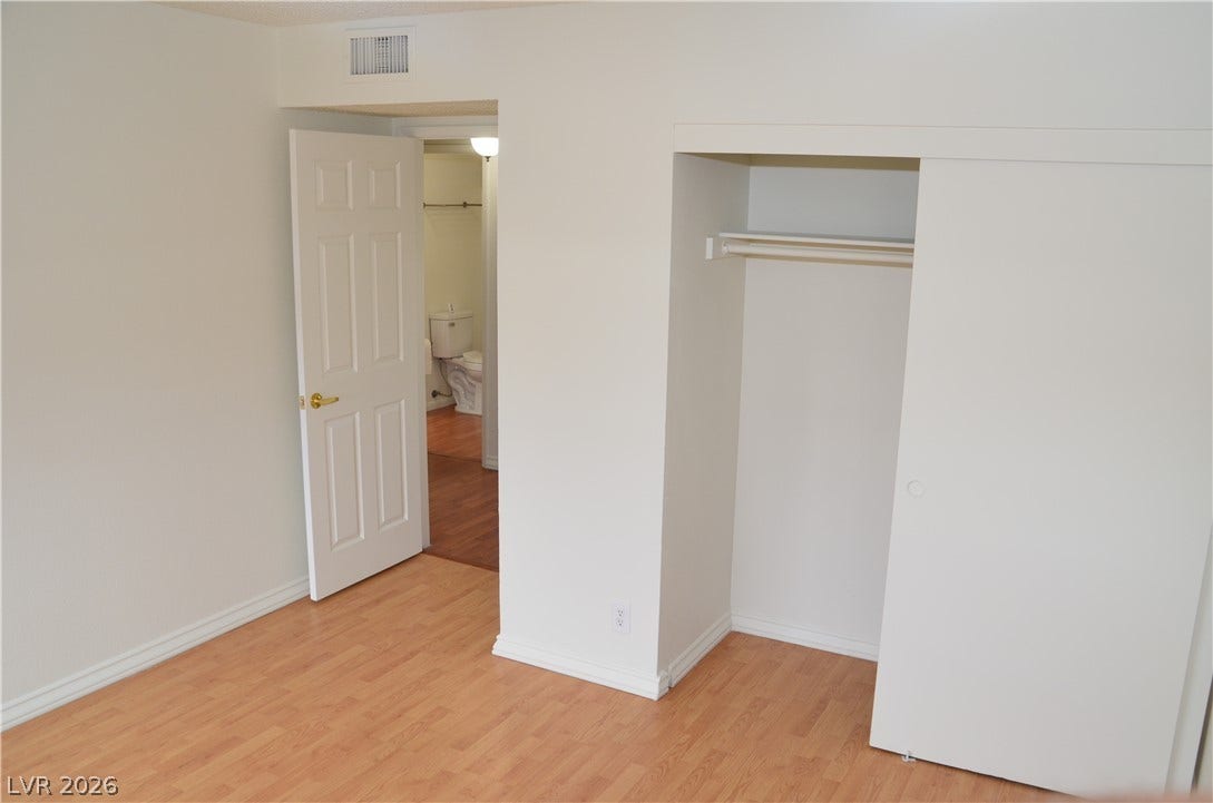 773 Cathy Lane, Henderson, NV 89015 Smooth wood-style flooring runs throughout this versatile room featuring a functional closet space.
