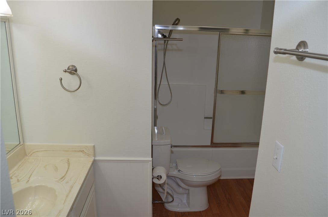 773 Cathy Lane, Henderson, NV 89015 A classic vanity station adjoins a separate bathroom space featuring sliding tub doors.