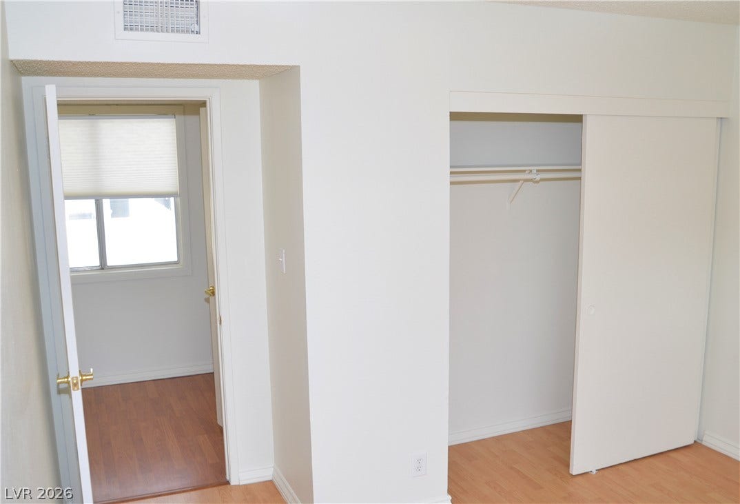 773 Cathy Lane, Henderson, NV 89015 Smooth wood flooring and a sliding door closet define this neat interior space.