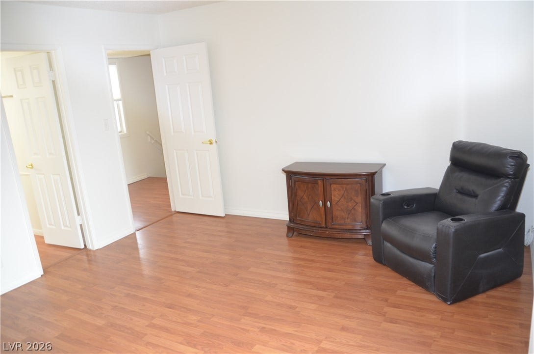 773 Cathy Lane, Henderson, NV 89015 Rich wood-textured flooring flows seamlessly across a bright, open living space.