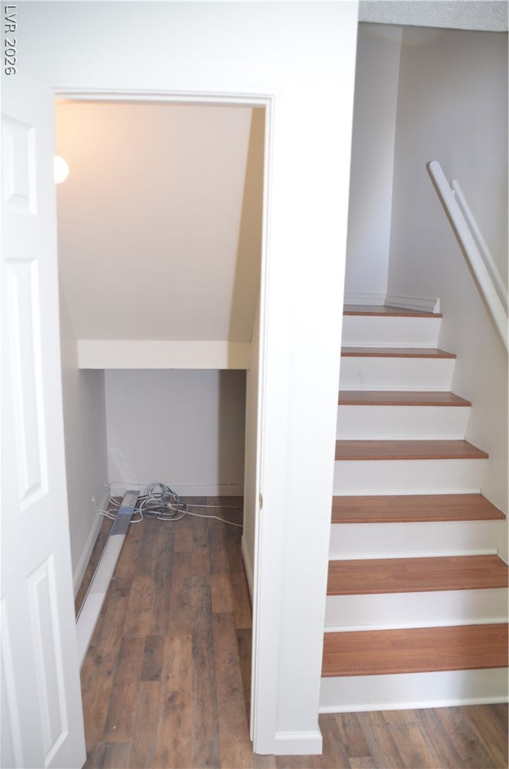 773 Cathy Lane, Henderson, NV 89015 Smartly designed under-stair storage sits directly adjacent to a clean wood-tread staircase.