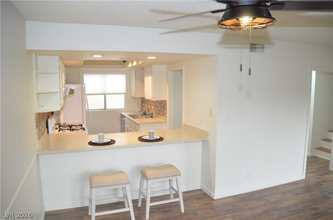 773 Cathy Lane, Henderson, NV 89015 An open pass-through breakfast bar connects the kitchen to the main living area.