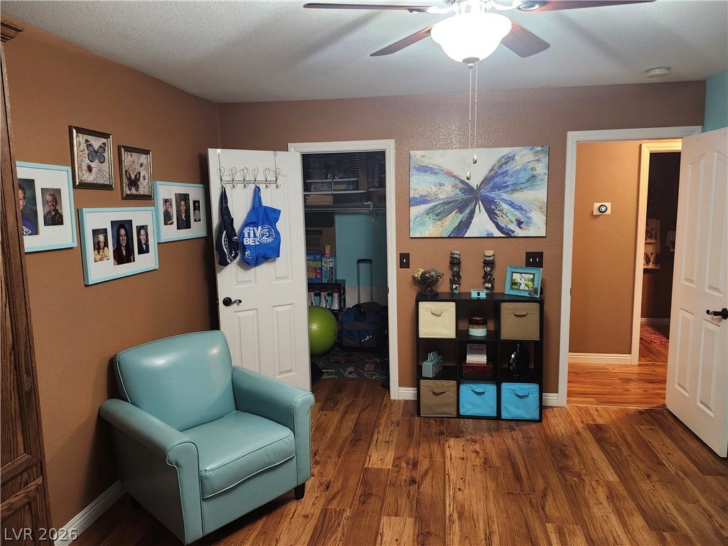 Gleaming hardwood floors and classic crown molding accent this versatile secondary living space.
