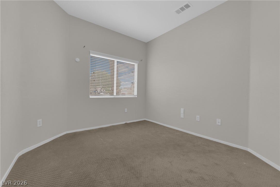 2653 Thunder Struck Court, North Las Vegas, NV 89030 High ceilings and neutral-toned carpeting define this versatile secondary bedroom space.