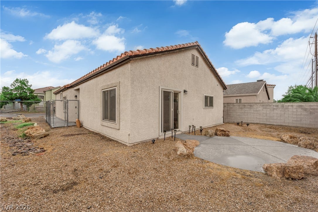 2653 Thunder Struck Court, North Las Vegas, NV 89030 Low-maintenance desert landscaping surrounds a concrete patio area outside this stucco home.