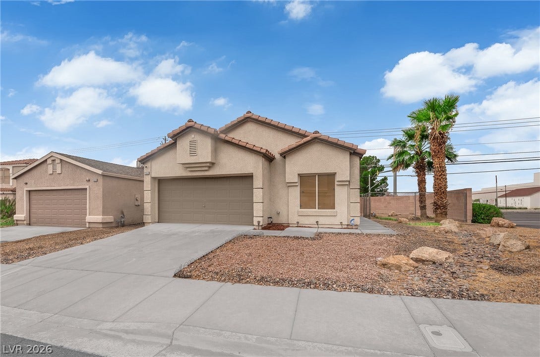 2653 Thunder Struck Court, North Las Vegas, NV 89030 An inviting single-story facade features stucco exterior walls and a classic tile roof.