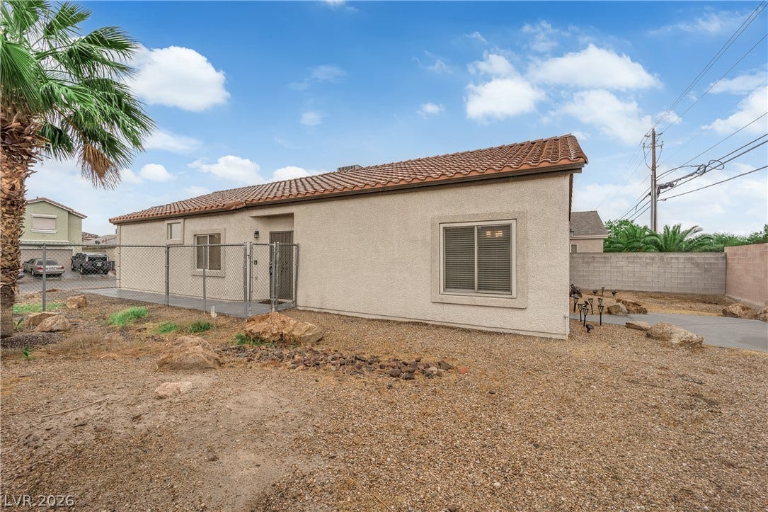 2653 Thunder Struck Court, North Las Vegas, NV 89030 Low-maintenance desert landscaping frames a stucco exterior topped with a classic tile roof.