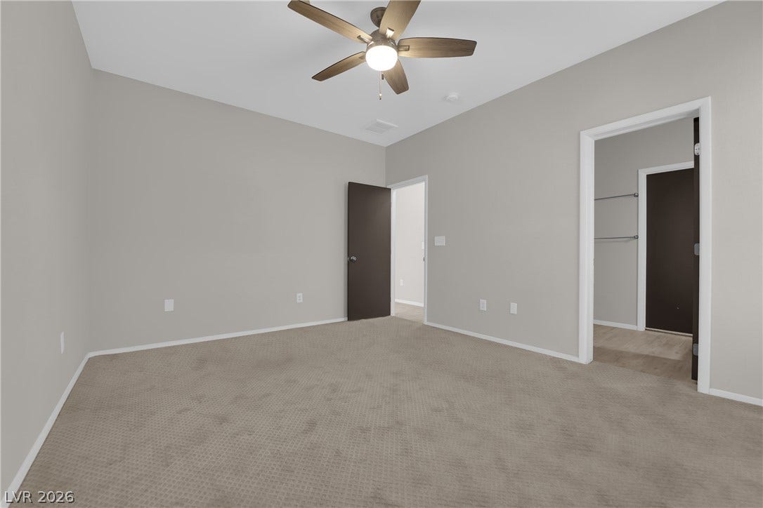 2653 Thunder Struck Court, North Las Vegas, NV 89030 Plush carpeting and neutral walls define this versatile bedroom space.