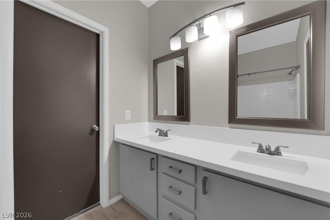 2653 Thunder Struck Court, North Las Vegas, NV 89030 Clean lines and a spacious double vanity define this modern bathroom space.