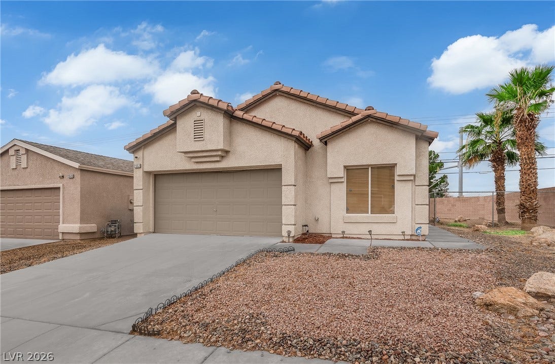 2653 Thunder Struck Court, North Las Vegas, NV 89030 Tiled rooflines and a stucco exterior define this charming single-story desert home.