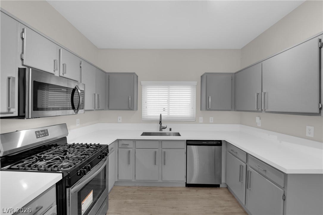 2653 Thunder Struck Court, North Las Vegas, NV 89030 Crisp quartz countertops pair with sleek cabinetry and stainless steel appliances in this kitchen.