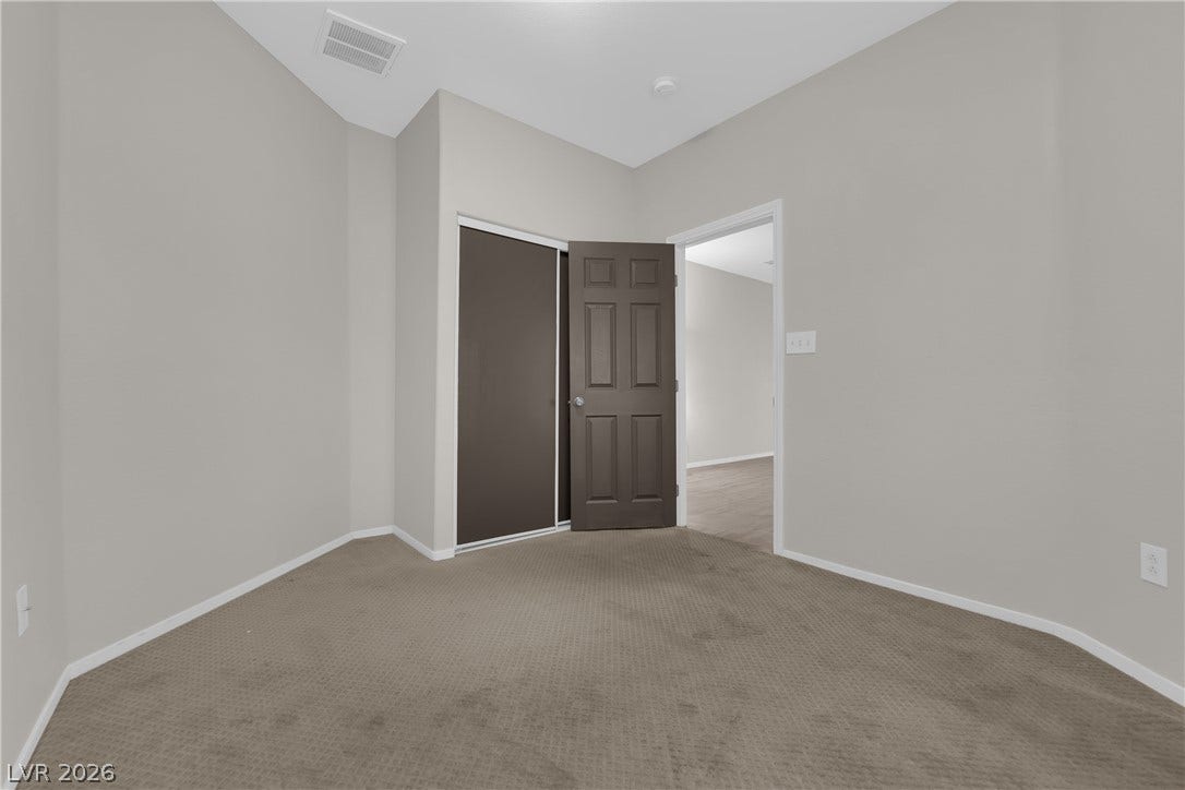 2653 Thunder Struck Court, North Las Vegas, NV 89030 Plush carpeting anchors this versatile room boasting high ceilings and a sliding closet door.