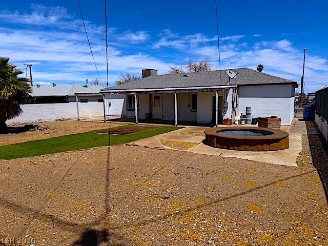 107 Joshua Street, Henderson, NV 89015 A spacious backyard area includes a covered patio and low-maintenance desert landscaping.