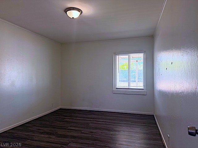 107 Joshua Street, Henderson, NV 89015 Gleaming wood floors anchor this versatile room illuminated by natural light from a central window.