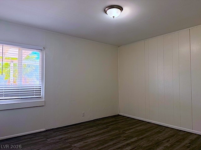 107 Joshua Street, Henderson, NV 89015 Hardwood floors and a paneled accent wall characterize this versatile room.