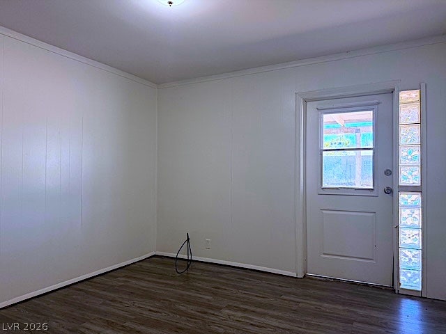 107 Joshua Street, Henderson, NV 89015 Smooth wood-look flooring and a glass-block sidelight entry accent this versatile living space.