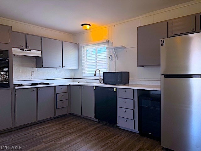 107 Joshua Street, Henderson, NV 89015 Functional cabinetry and resilient flooring define this practical kitchen layout.