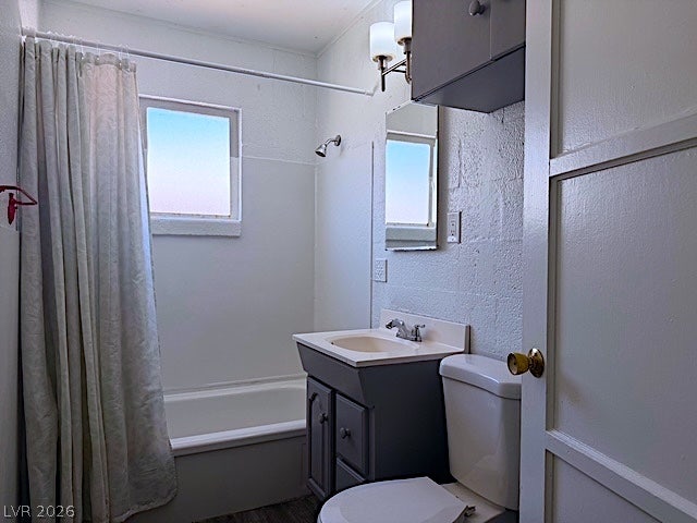 107 Joshua Street, Henderson, NV 89015 Natural light pours through the window in this classic bathroom featuring a compact vanity setup.