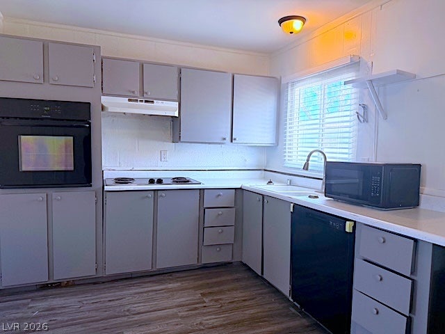 107 Joshua Street, Henderson, NV 89015 Ample cabinetry and durable wood-look flooring anchor this functional kitchen workspace.