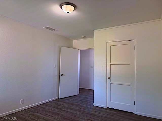 107 Joshua Street, Henderson, NV 89015 Smooth wood-style flooring runs through this versatile interior space with clean white walls.