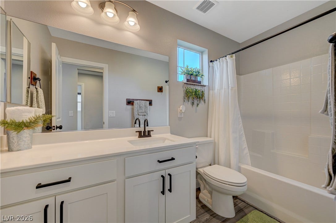 6629 Rockhouse Street, North Las Vegas, NV 89086 Clean lines and classic tile finishes define this functional full bathroom layout.