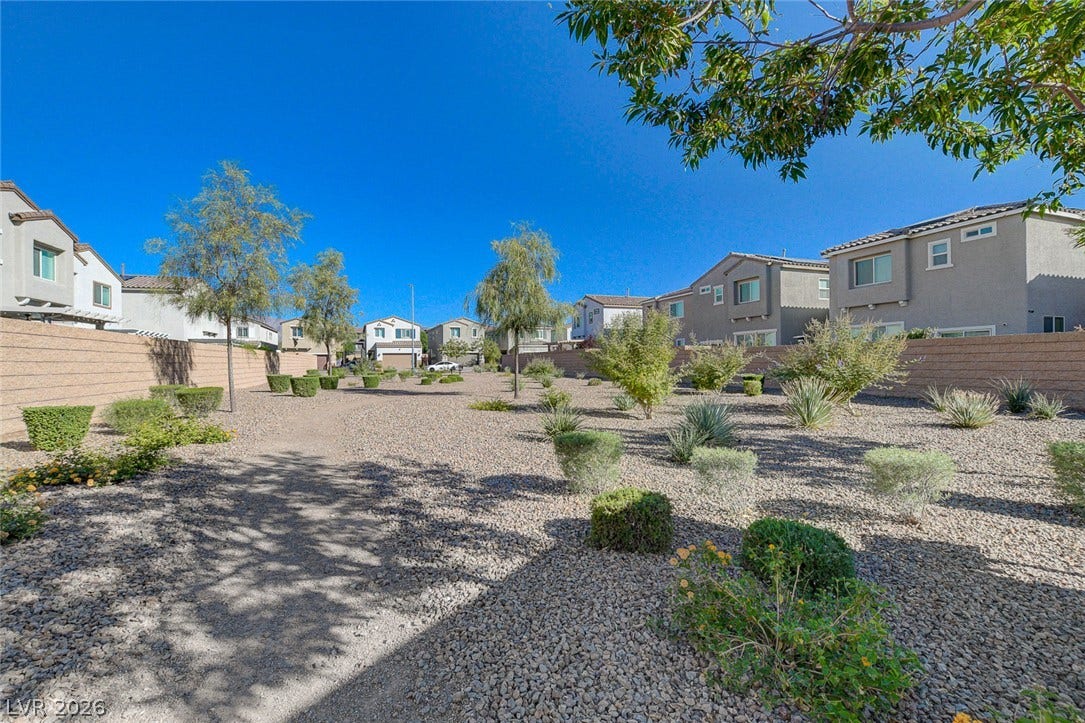 6629 Rockhouse Street, North Las Vegas, NV 89086 Desert-inspired landscaping defines this low-maintenance common area surrounded by multi-level suburban residences.