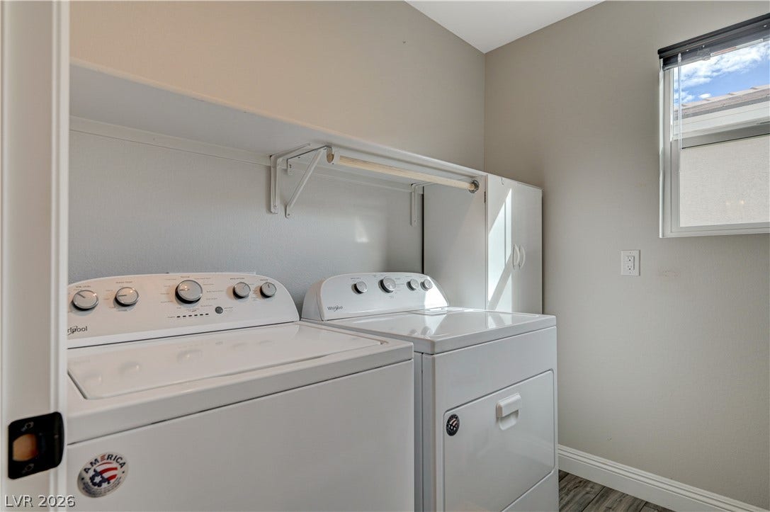 6629 Rockhouse Street, North Las Vegas, NV 89086 Functional laundry space showcases durable wood-look flooring alongside a high window for natural light.
