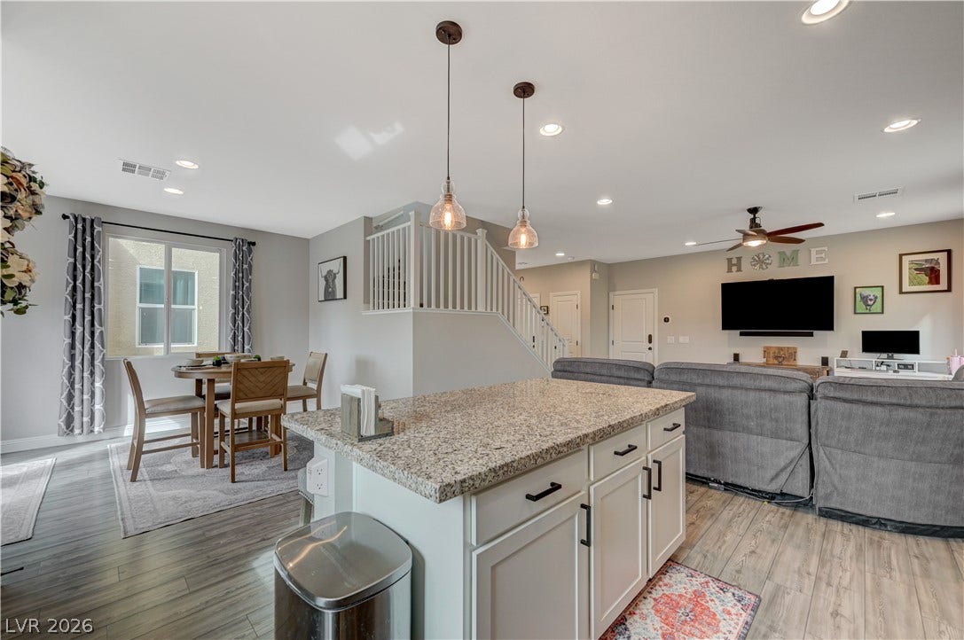 6629 Rockhouse Street, North Las Vegas, NV 89086 An open floorplan seamlessly connects the kitchen island to the dining and living spaces.