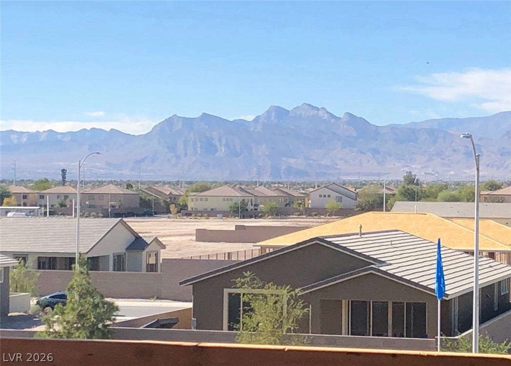 6629 Rockhouse Street, North Las Vegas, NV 89086 Sweeping mountain vistas rise above the surrounding neighborhood rooftops.
