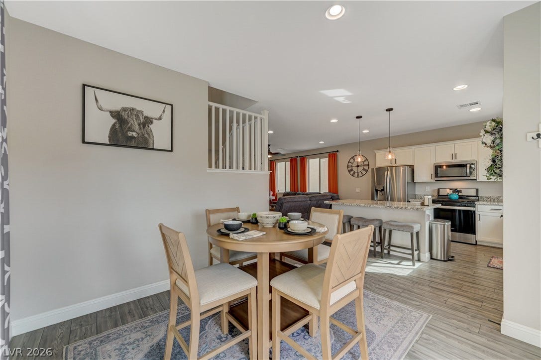 6629 Rockhouse Street, North Las Vegas, NV 89086 An open layout connects the intimate dining area directly to the kitchen beyond.