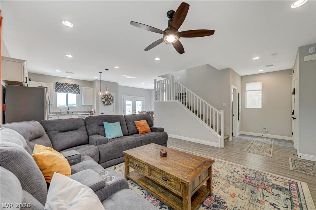 6629 Rockhouse Street, North Las Vegas, NV 89086 An open floorplan connects the comfortable living area to the kitchen and staircase.