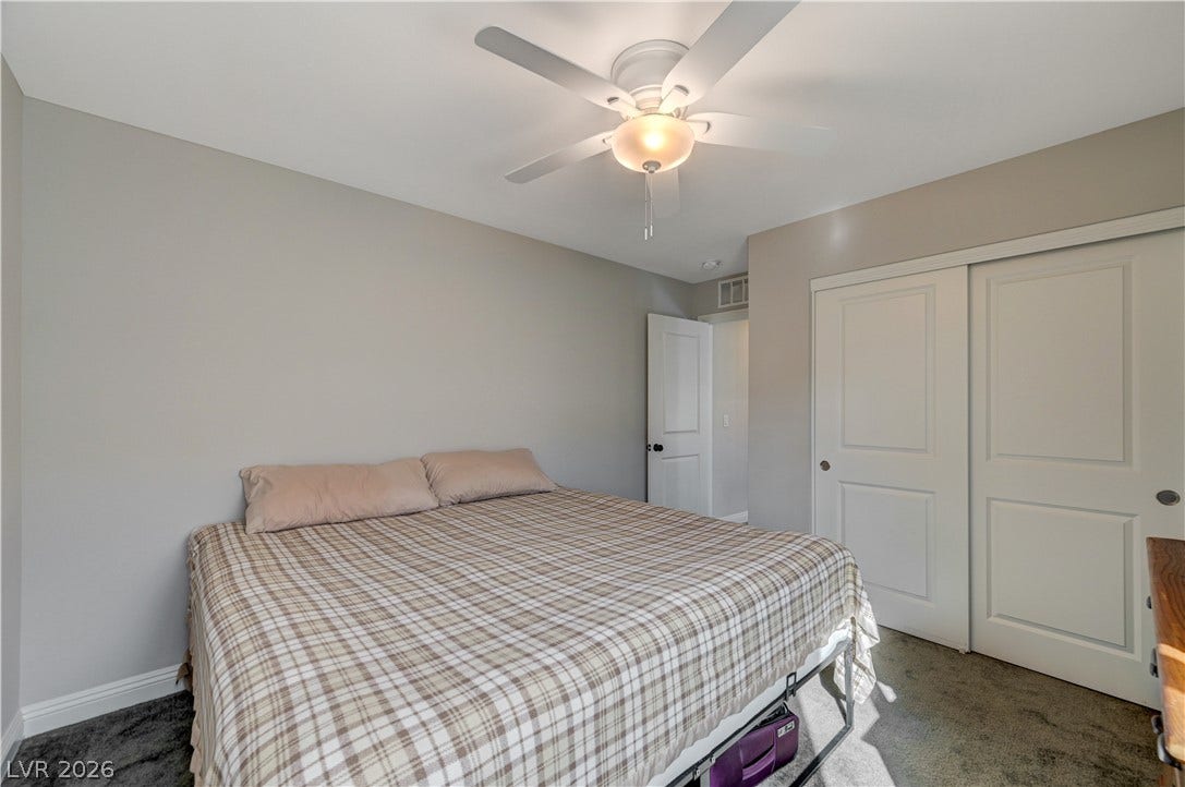 6629 Rockhouse Street, North Las Vegas, NV 89086 Soft carpeting pairs with neutral walls in this comfortable bedroom space.