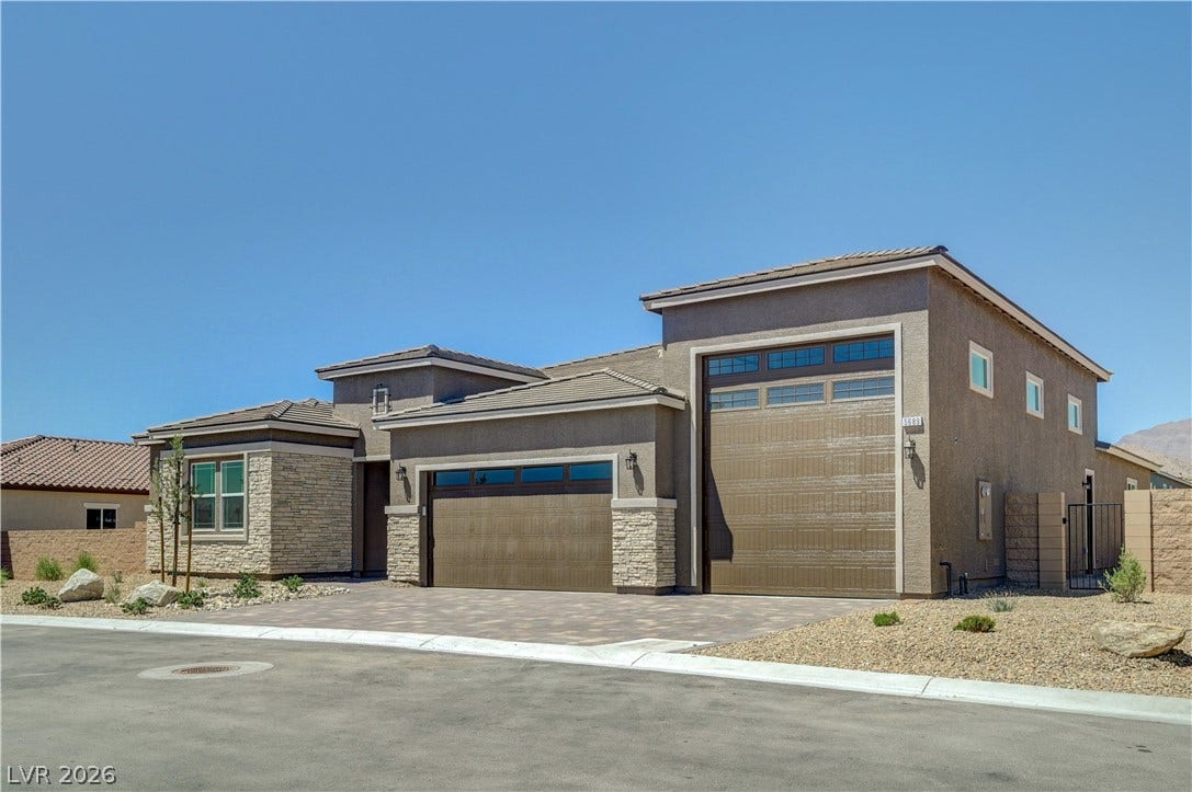 5689 Searching Bear Court, Las Vegas, NV 89149 A modern facade with a stone and stucco exterior presents a welcoming curb appeal.