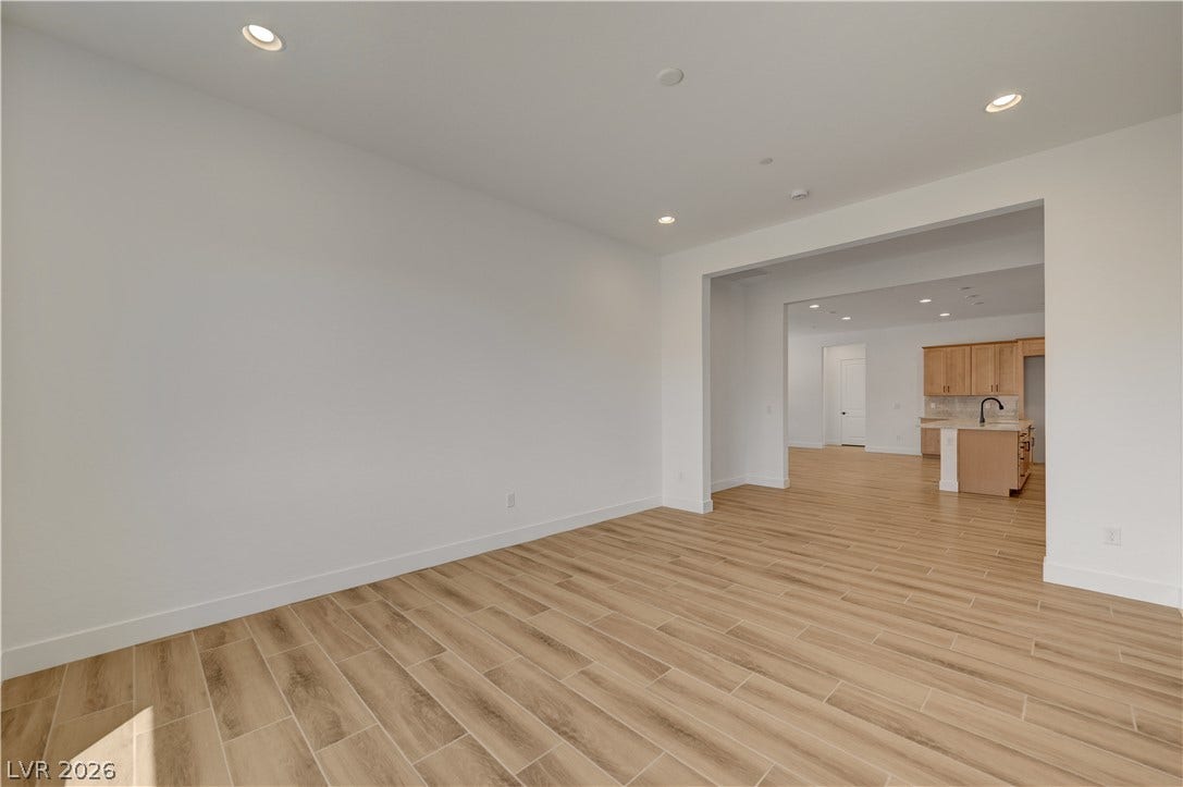 5689 Searching Bear Court, Las Vegas, NV 89149 Clean lines and wood-look tile flooring define this flexible living space.