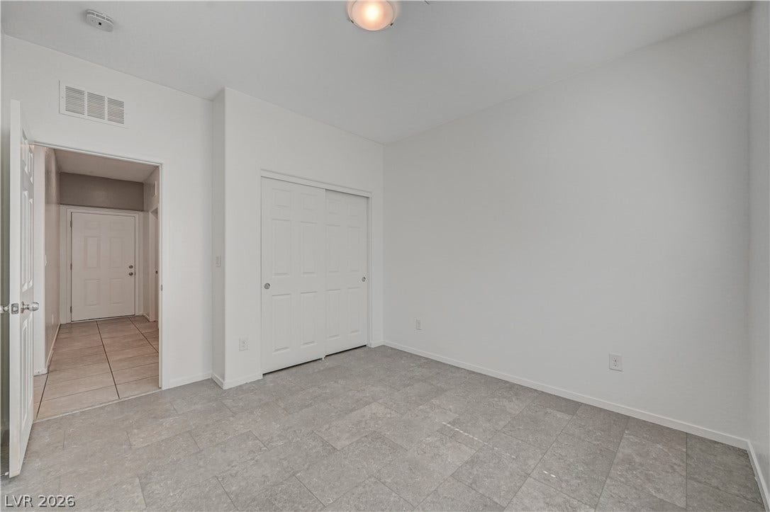 2455 Sunflower Days Avenue, #1056, North Las Vegas, NV 89031 Smooth tile flooring and clean lines define this versatile secondary room.