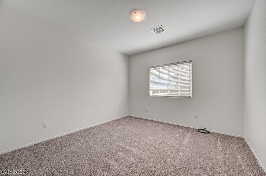 2455 Sunflower Days Avenue, #1056, North Las Vegas, NV 89031 Plush wall-to-wall carpeting and clean neutral walls define this versatile bedroom space.