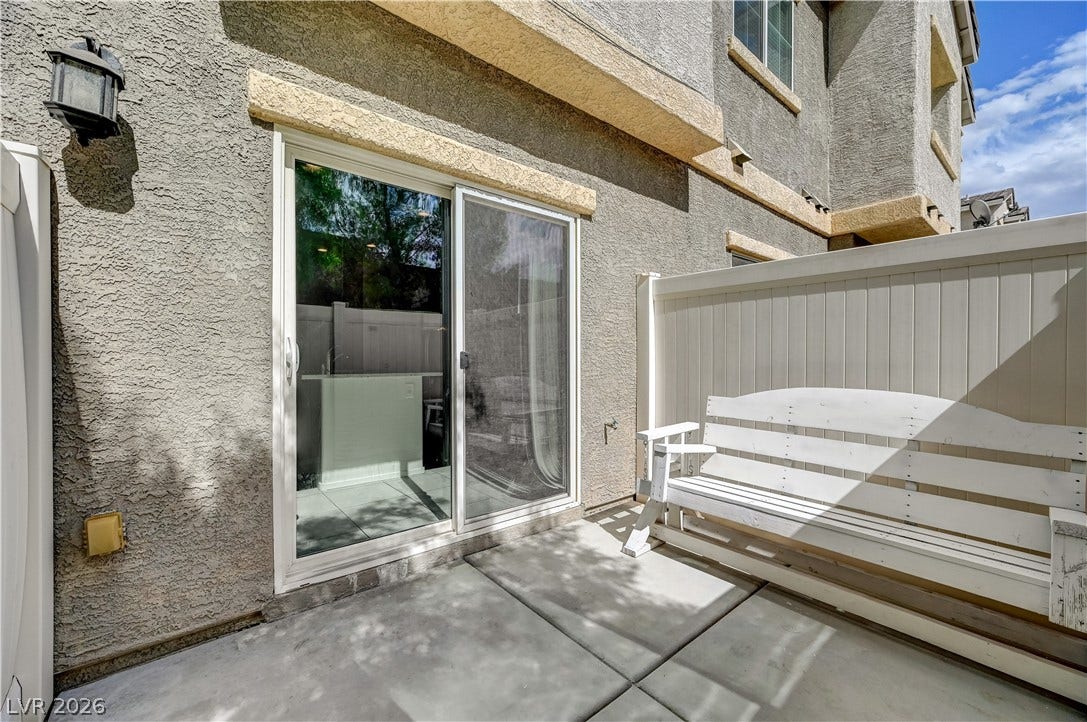 2455 Sunflower Days Avenue, #1056, North Las Vegas, NV 89031 Sliding glass doors open directly to a private, low-maintenance concrete patio area.