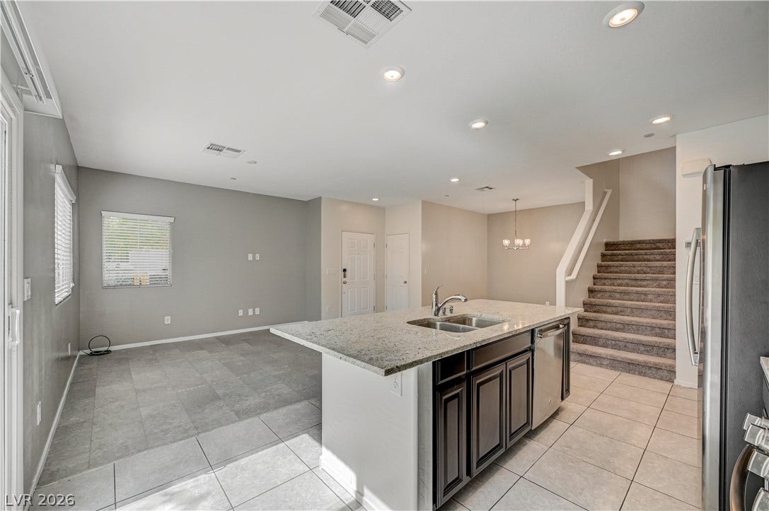 2455 Sunflower Days Avenue, #1056, North Las Vegas, NV 89031 An open floorplan seamlessly connects the functional kitchen space to the surrounding living areas.