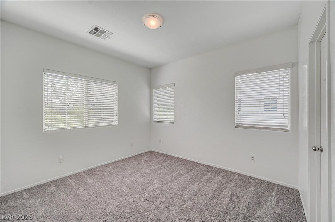2455 Sunflower Days Avenue, #1056, North Las Vegas, NV 89031 Plentiful windows invite natural light into this clean, carpeted space.