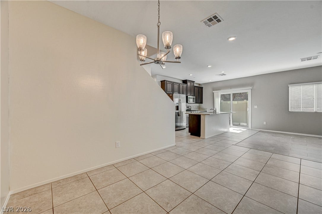 2455 Sunflower Days Avenue, #1056, North Las Vegas, NV 89031 An open concept floor plan flows effortlessly from the dining area to the kitchen.