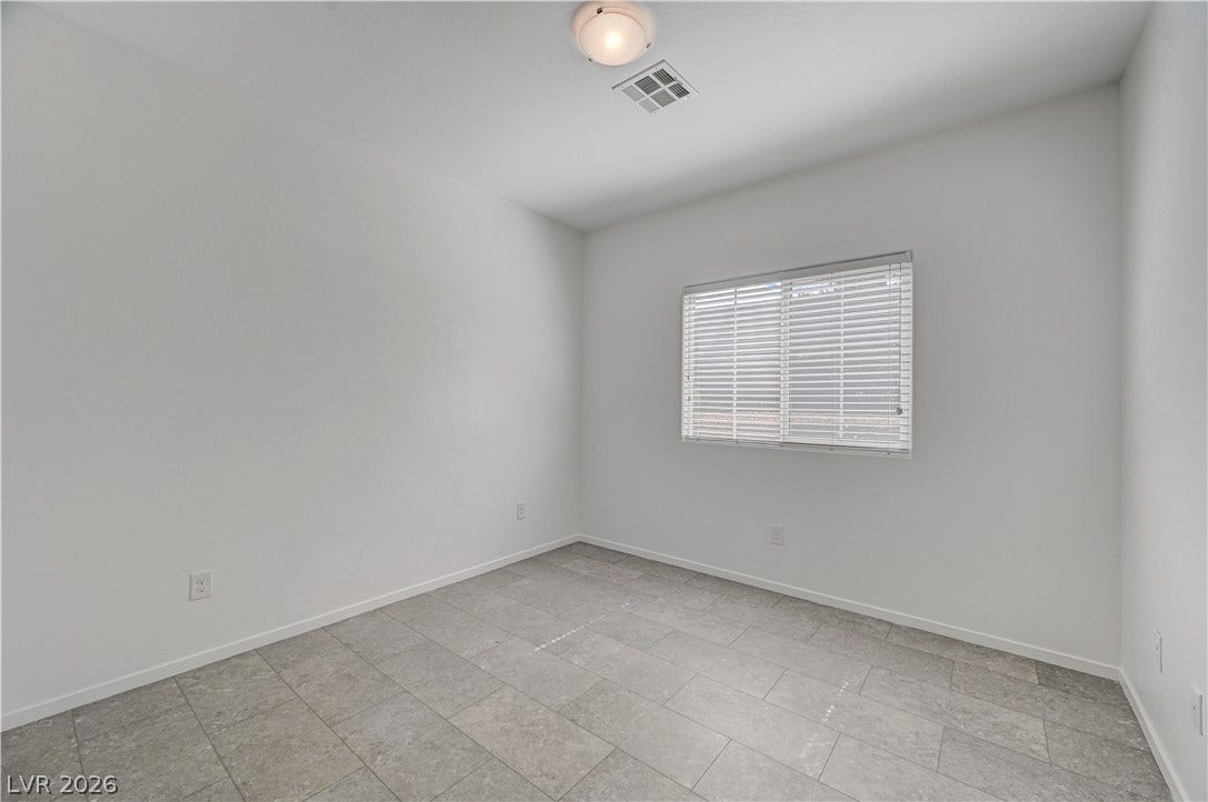 2455 Sunflower Days Avenue, #1056, North Las Vegas, NV 89031 A single window provides natural light to this room finished with neutral tile flooring.