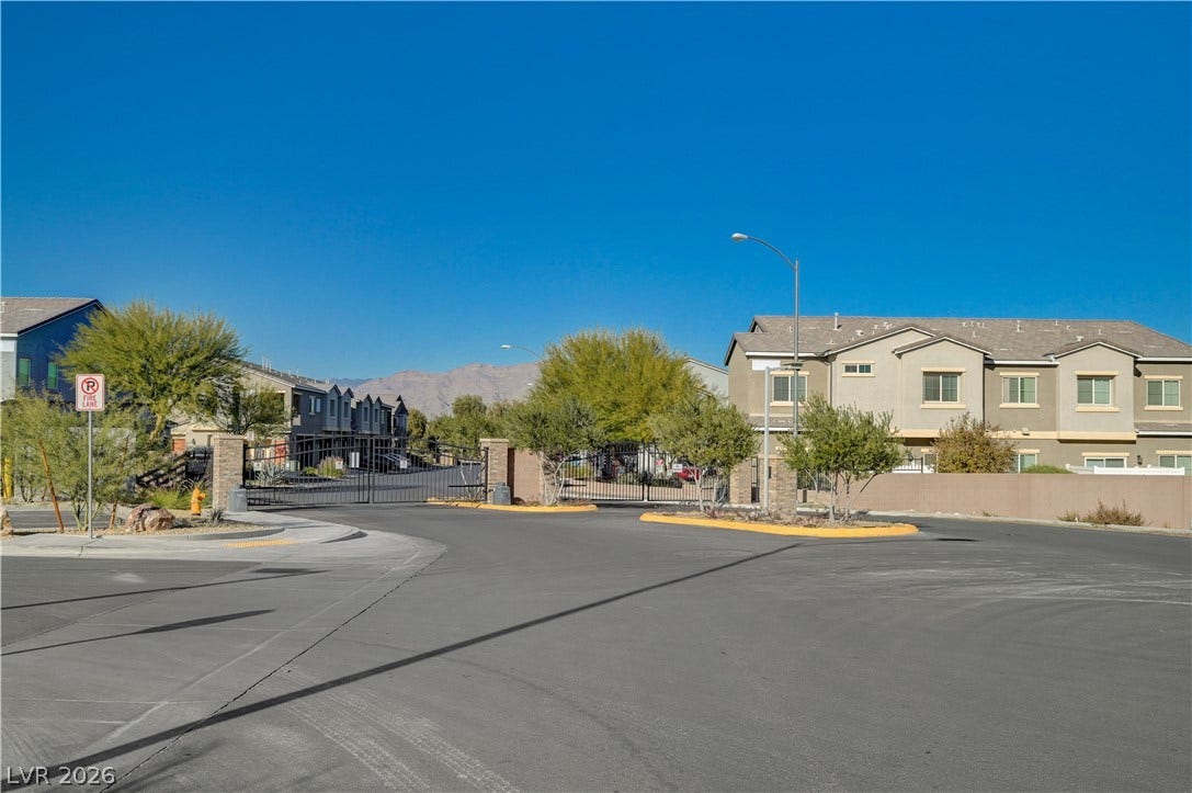 2455 Sunflower Days Avenue, #1056, North Las Vegas, NV 89031 Secure gated access leads to this modern residential community framed by desert mountain vistas.