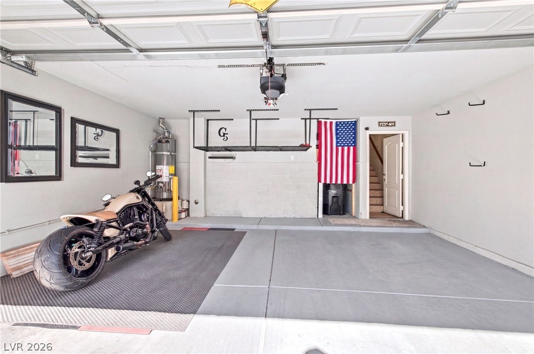 2752 Fountain Vista Lane, Henderson, NV 89074 An immaculate concrete floor details this spacious and functional multi-car parking area.