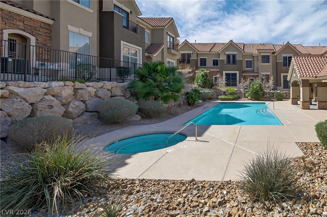 2752 Fountain Vista Lane, Henderson, NV 89074 An inviting outdoor pool and integrated spa sit surrounded by beautiful desert landscaping.