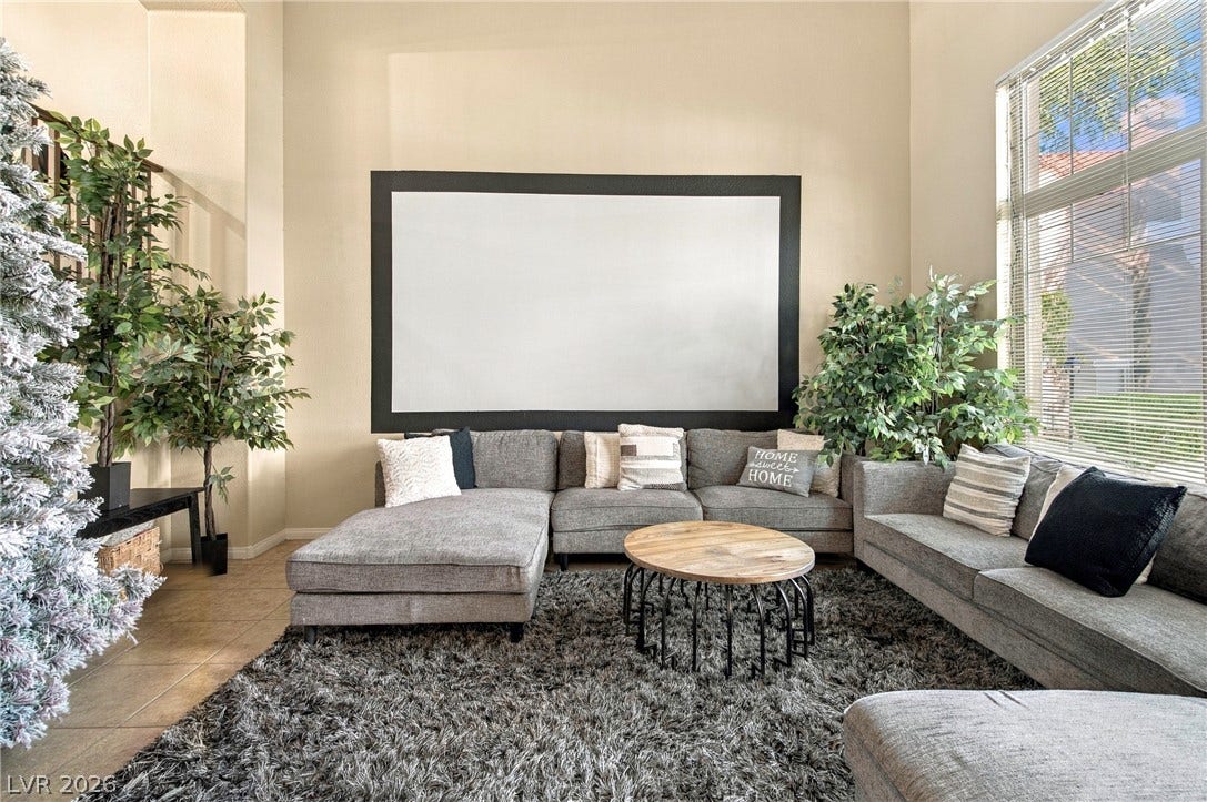 2752 Fountain Vista Lane, Henderson, NV 89074 High ceilings and tall windows enhance the natural light in this spacious living area.