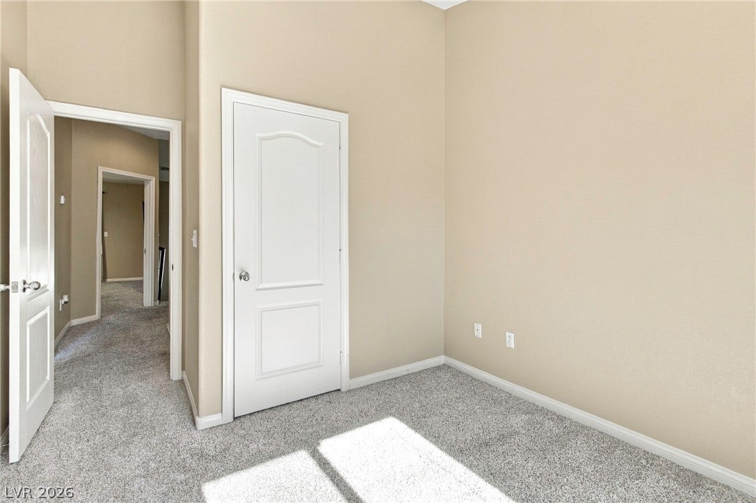 2752 Fountain Vista Lane, Henderson, NV 89074 Plush carpeted flooring and high ceilings define this versatile interior space.