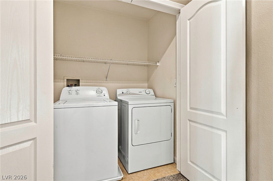 2752 Fountain Vista Lane, Henderson, NV 89074 Convenient storage shelving and durable flooring maximize efficiency in this dedicated utility space.