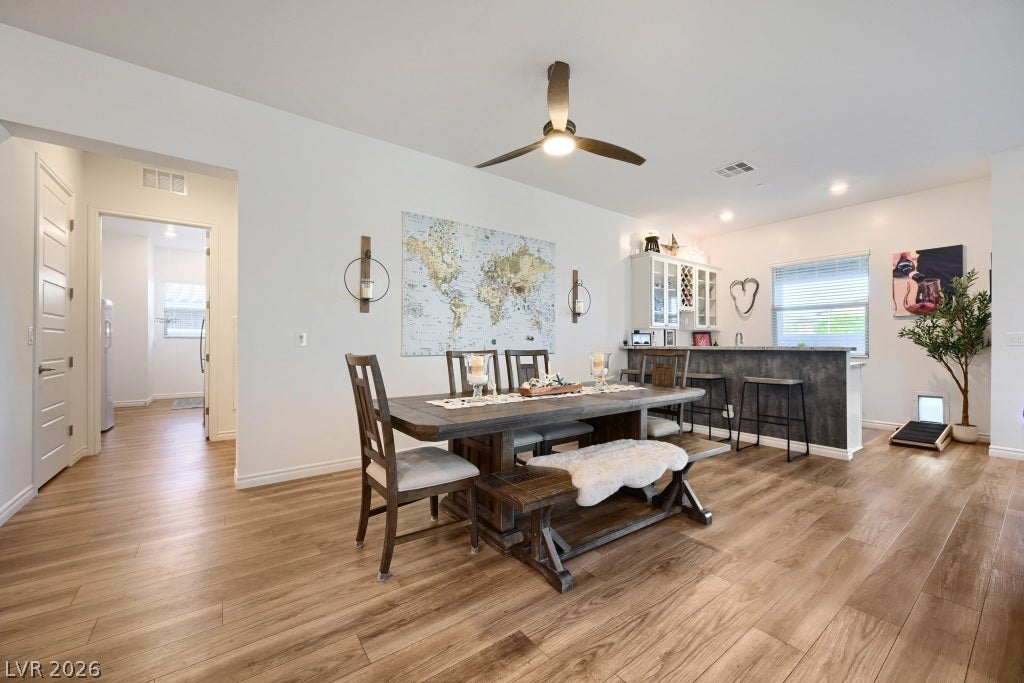 752 Dorsey Falls Street, Henderson, NV 89011 Warm wood-look flooring and an open layout create an inviting space for gatherings.